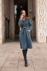 a lady in a denim dress with a belt